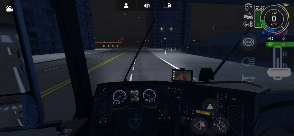 First person view from the truck dashboard during a night drive in the city within Grand Truck Simulator 2