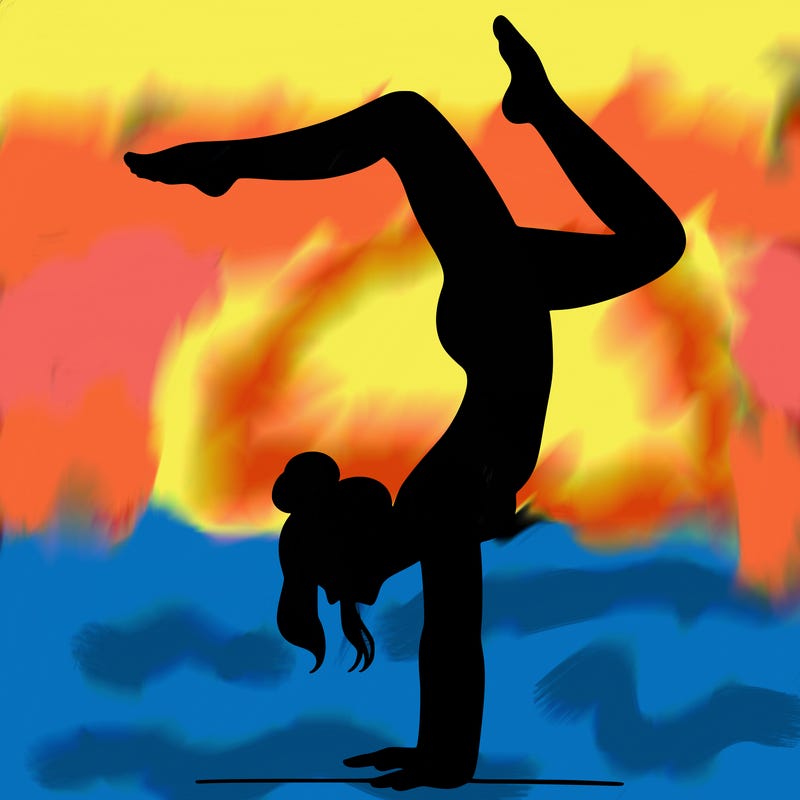 a woman doing a handstand