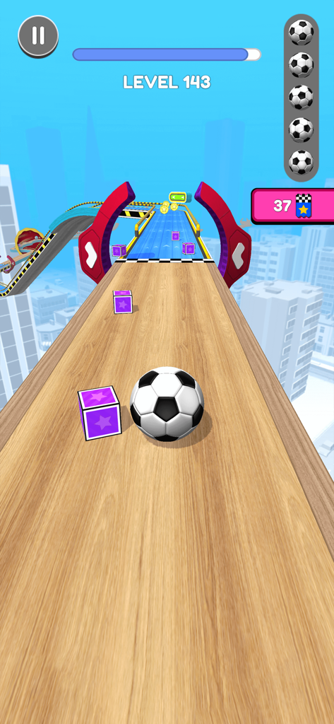 A soccer ball rolling on a wooden track above a city in the Going Balls mobile game
