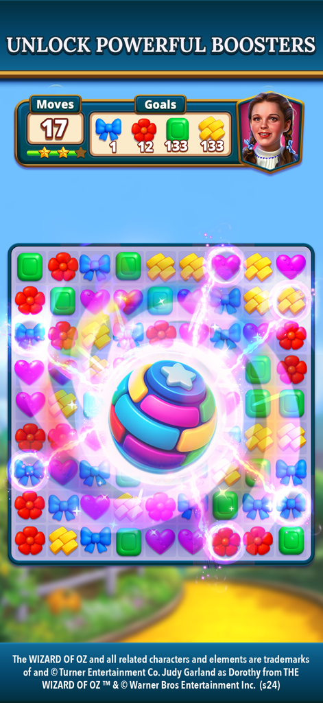The Wizard of Oz Magic Match 3 - A colorful match 3 puzzle board from The Wizard of Oz Magic Match app with a large glowing booster and Dorothy character portrait.