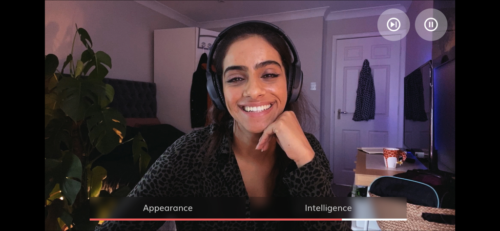 A scene from Five Dates featuring a woman on a video call with a choice menu for appearance or intelligence