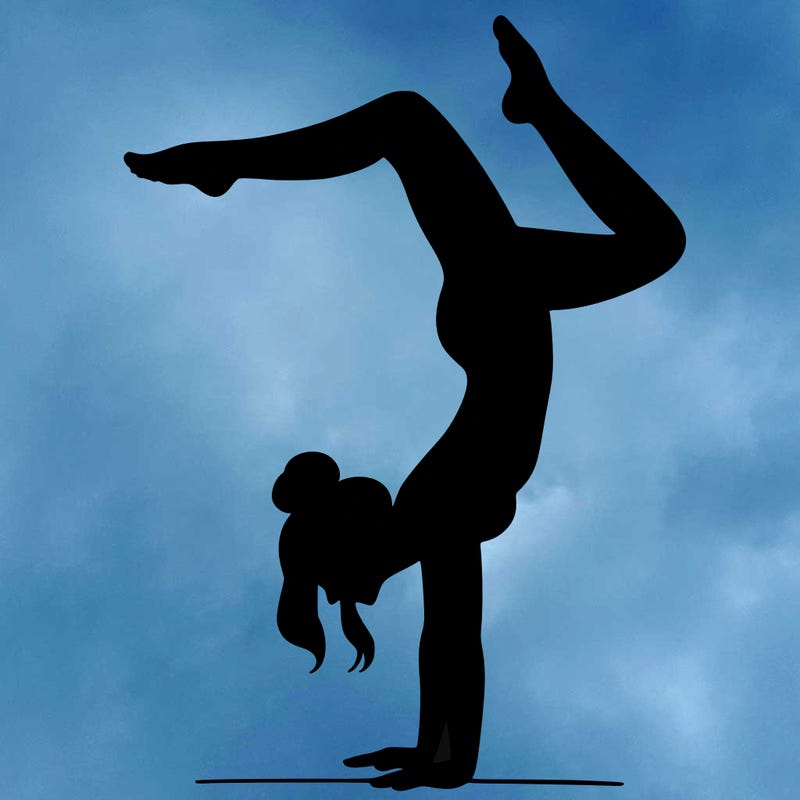 a woman doing a handstand