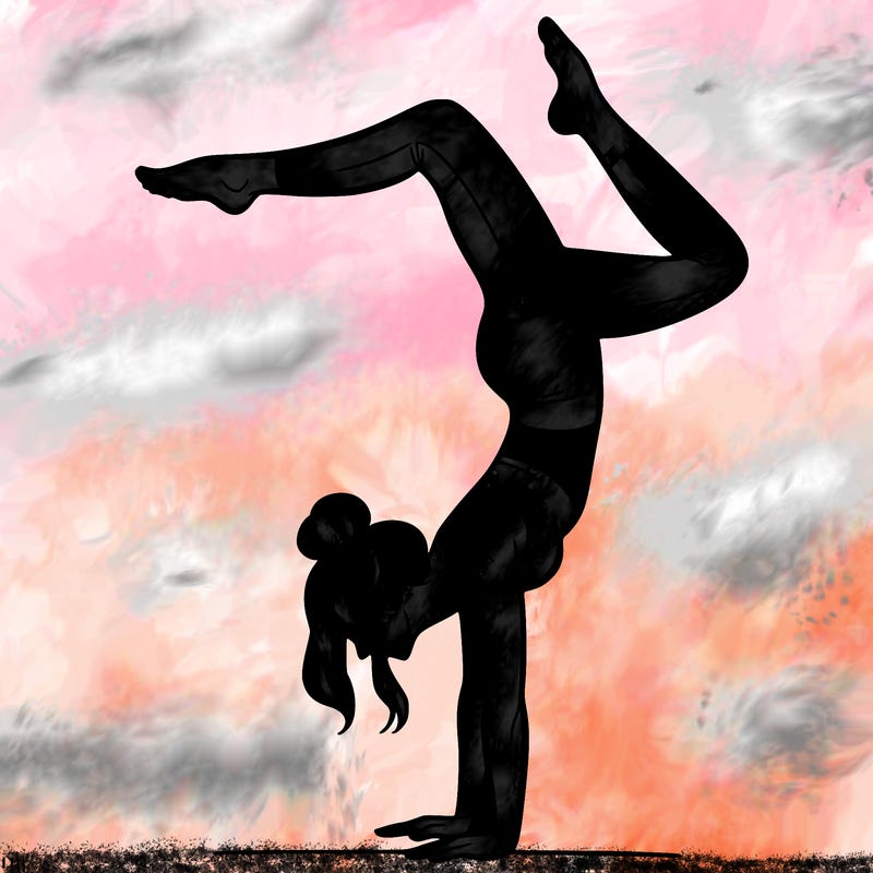 a woman doing a handstand