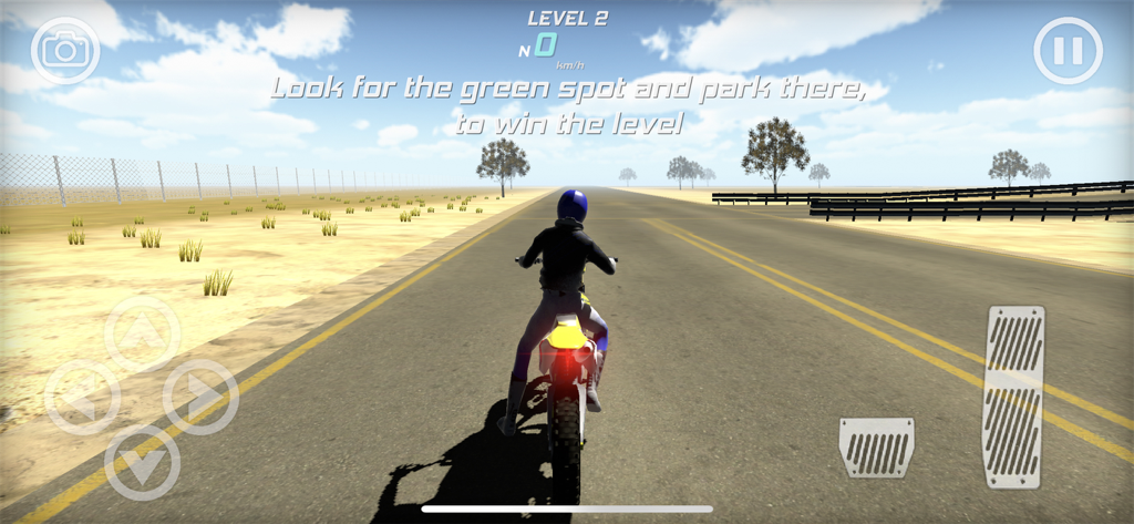 A motorbike rider on a desert road in MX Grau Simulator with game instructions on screen.