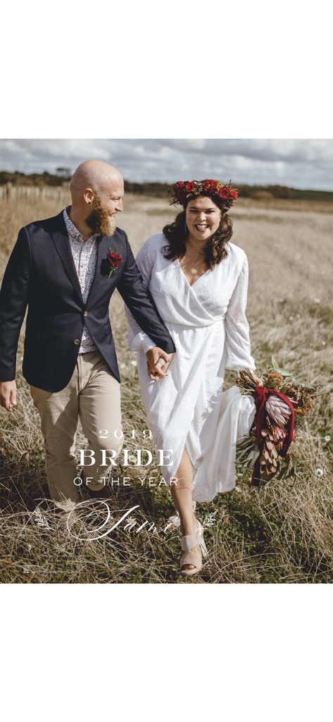 A happy bride and groom walking through a field featured as bride of the year