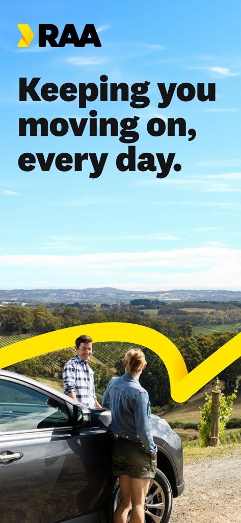 A couple standing next to their car overlooking a scenic South Australian vineyard with the RAA logo and slogan.