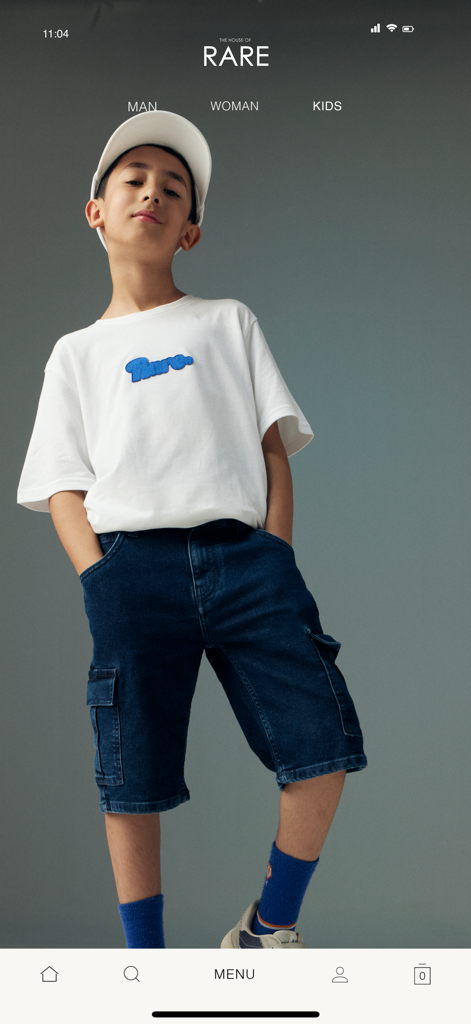 HOUSE OF RARE - Young boy modeling a white t-shirt and denim shorts from the House of Rare kids collection.