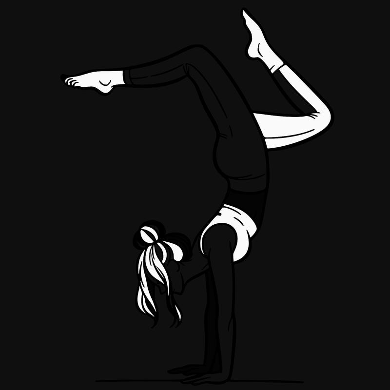 a woman doing a handstand