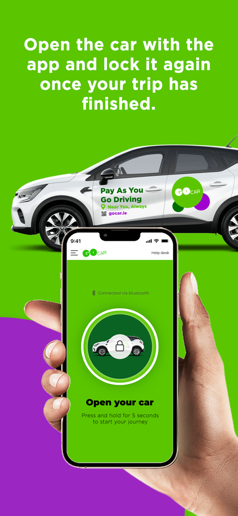 Hand holding a smartphone using the GoCar app to unlock a car with a digital key