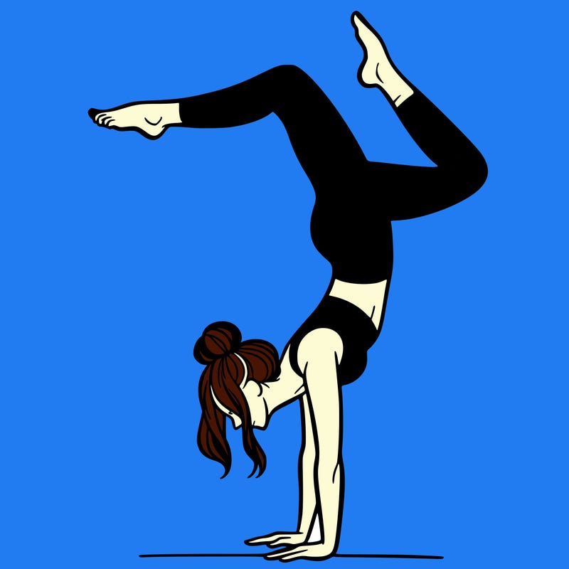 a woman doing a handstand