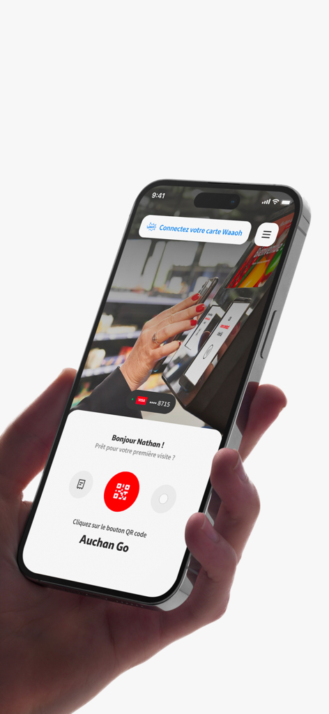 Auchan Go Le Lab (HQ) - A hand holding an iPhone showing the Auchan Go app welcome screen with a red QR code button for store entry