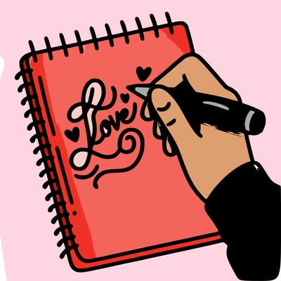 a hand writing “love” in calligraphy on a notebook