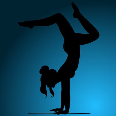 a woman doing a handstand