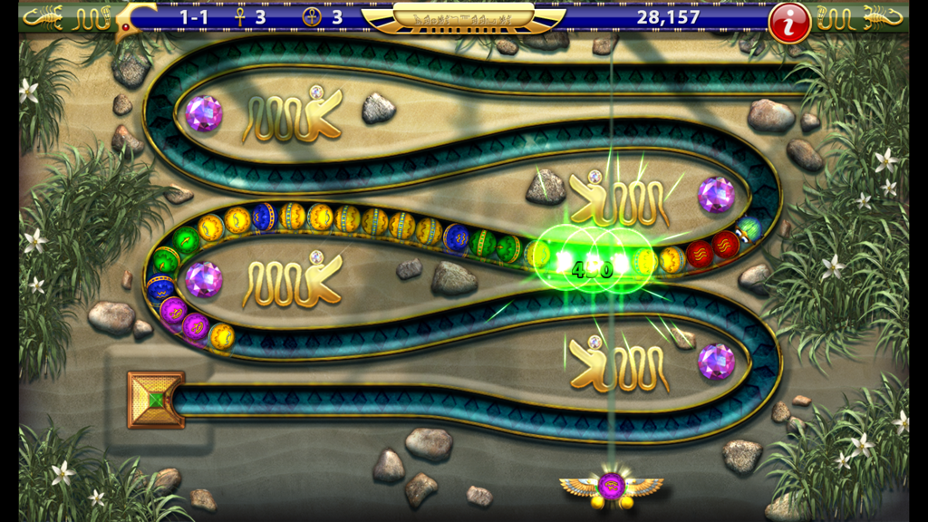 Luxor HD - Gameplay of Luxor HD marble shooter showing colored orbs moving along a winding track in an ancient Egyptian setting